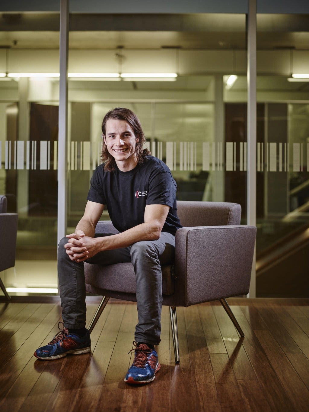 PhD student Jean-Philippe Maclean sitting in a chair