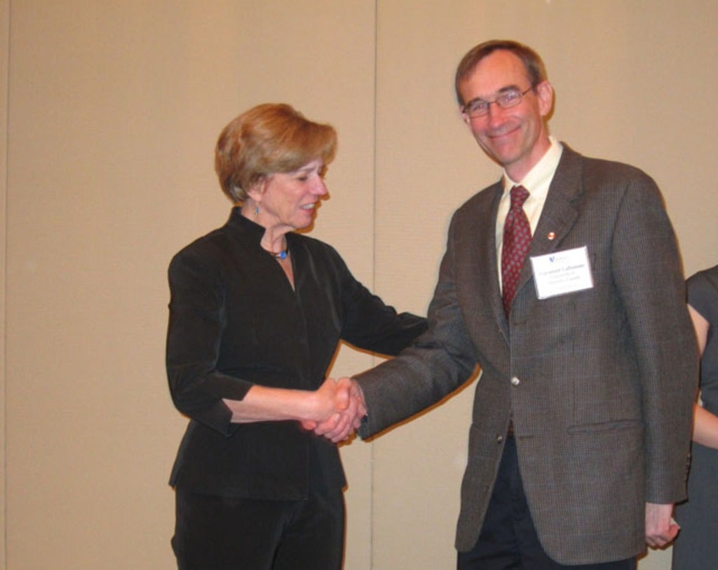  Raymond Laflamme receives his AAAS Fellowship from Dr. Nina Fedoroff 