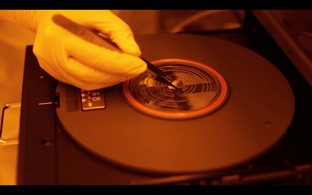 Researcher fabricating in the Mike and Ophelia Lazaridis Quantum-Nano Centre Nanofab facility.