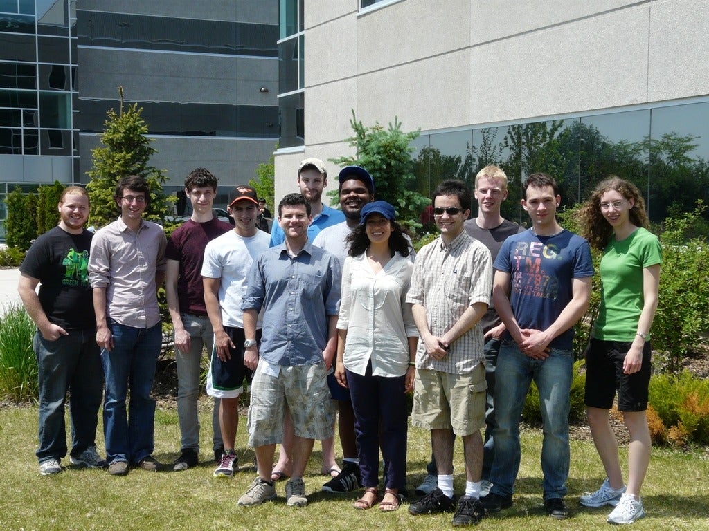 A group of students standing outside the QNC