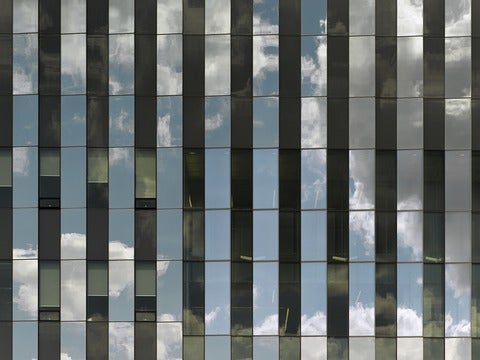 Clouds reflected in the window of the Quantum Nano Centre - home of IQC