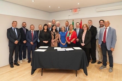 Group of Italian and IQC leadership after signing the Memorandum of Understanding