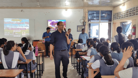 Rajbul Islam teaching in a classroom full of students