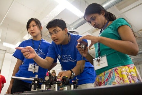  Students get hands-on experience with a quantum cryptography demo during QCSYS 2011