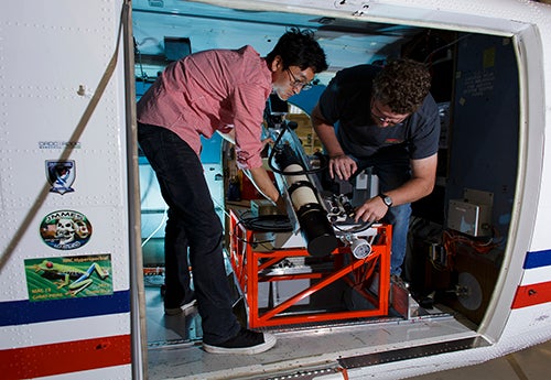 Postdoctoral fellow Jeongwan Jin and PhD candidate Christopher Pugh setting up Bob on the NRC Twin Otter Airborne Research Aircraft. 