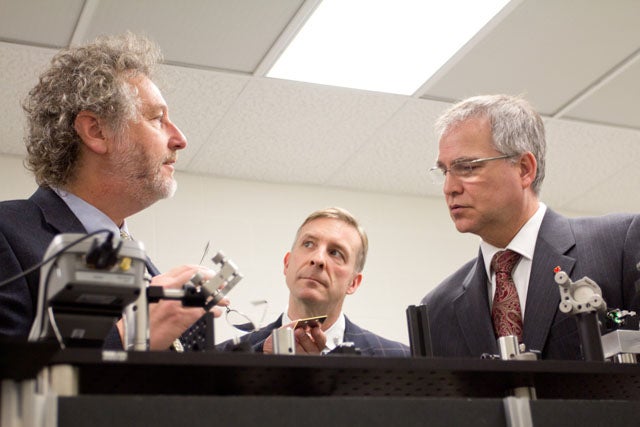 Prof. David Cory shows Minister Gary Goodyear and Kitchener-Waterloo MP Peter Braid around his lab at IQC