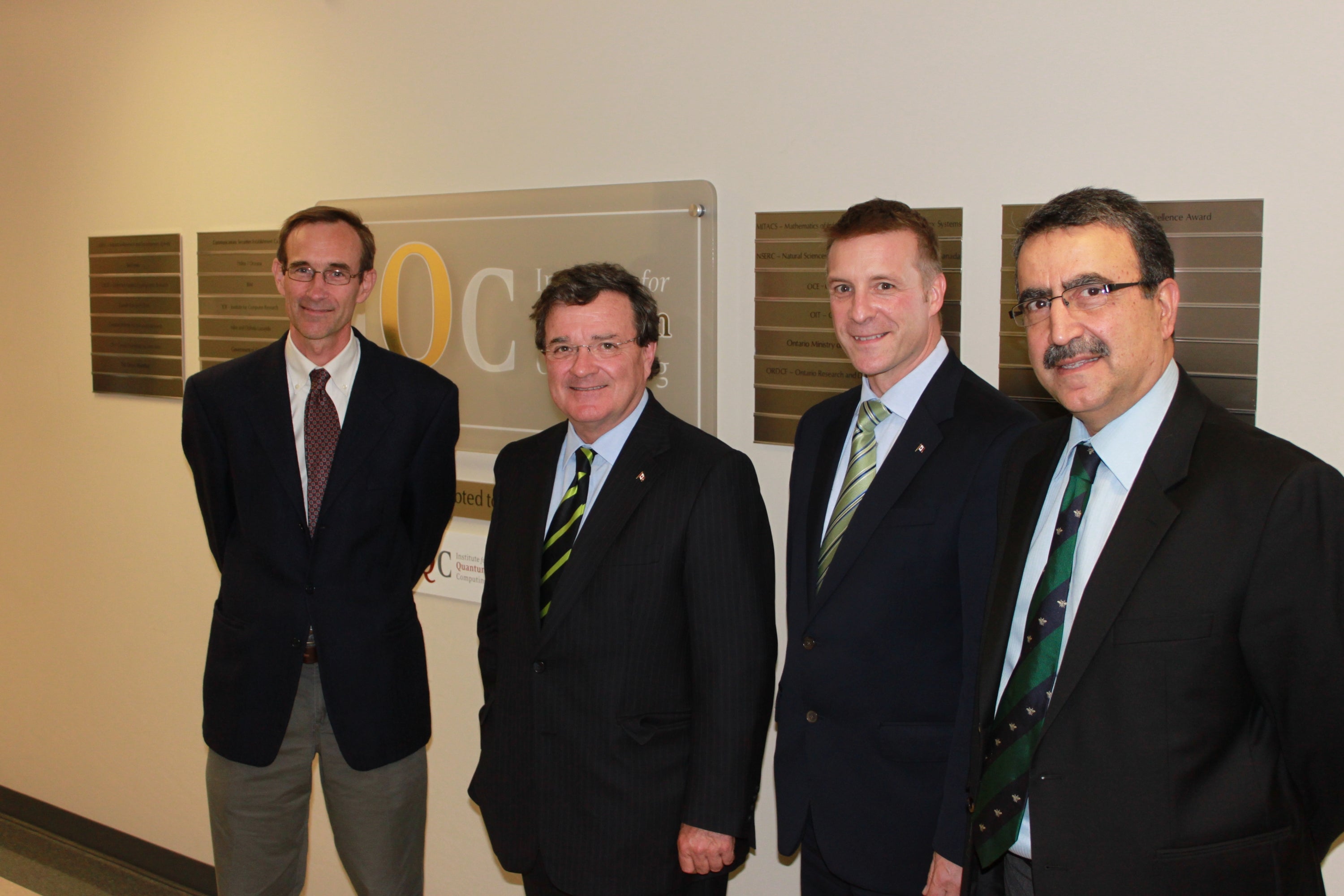 Jim Flaherty standing next to members of the IQC and the President of Waterloo