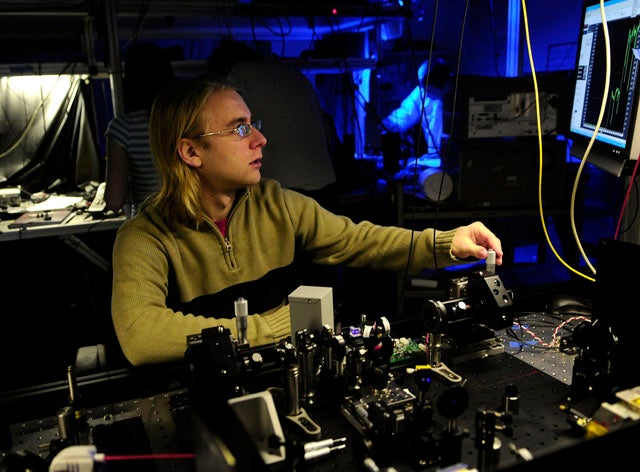  Deny Hamel working in an IQC optics lab 