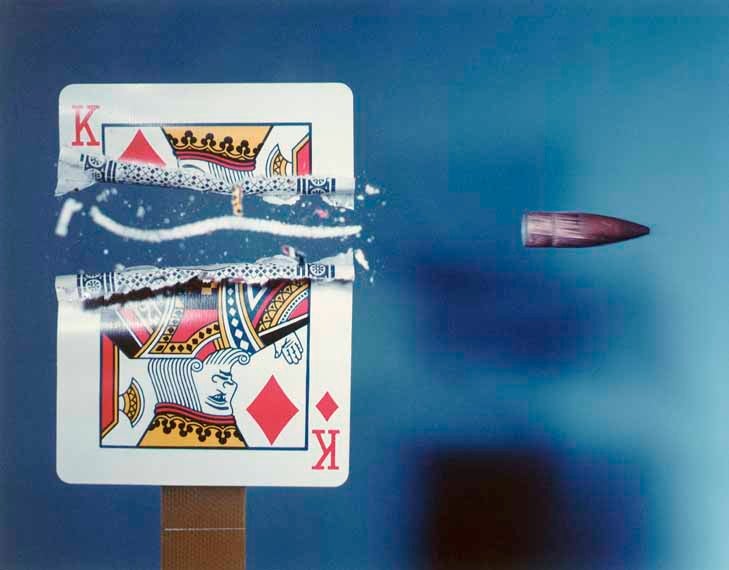 Bullet slicing through playing card