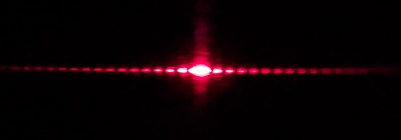 An interference pattern seen when light passes around a small object.