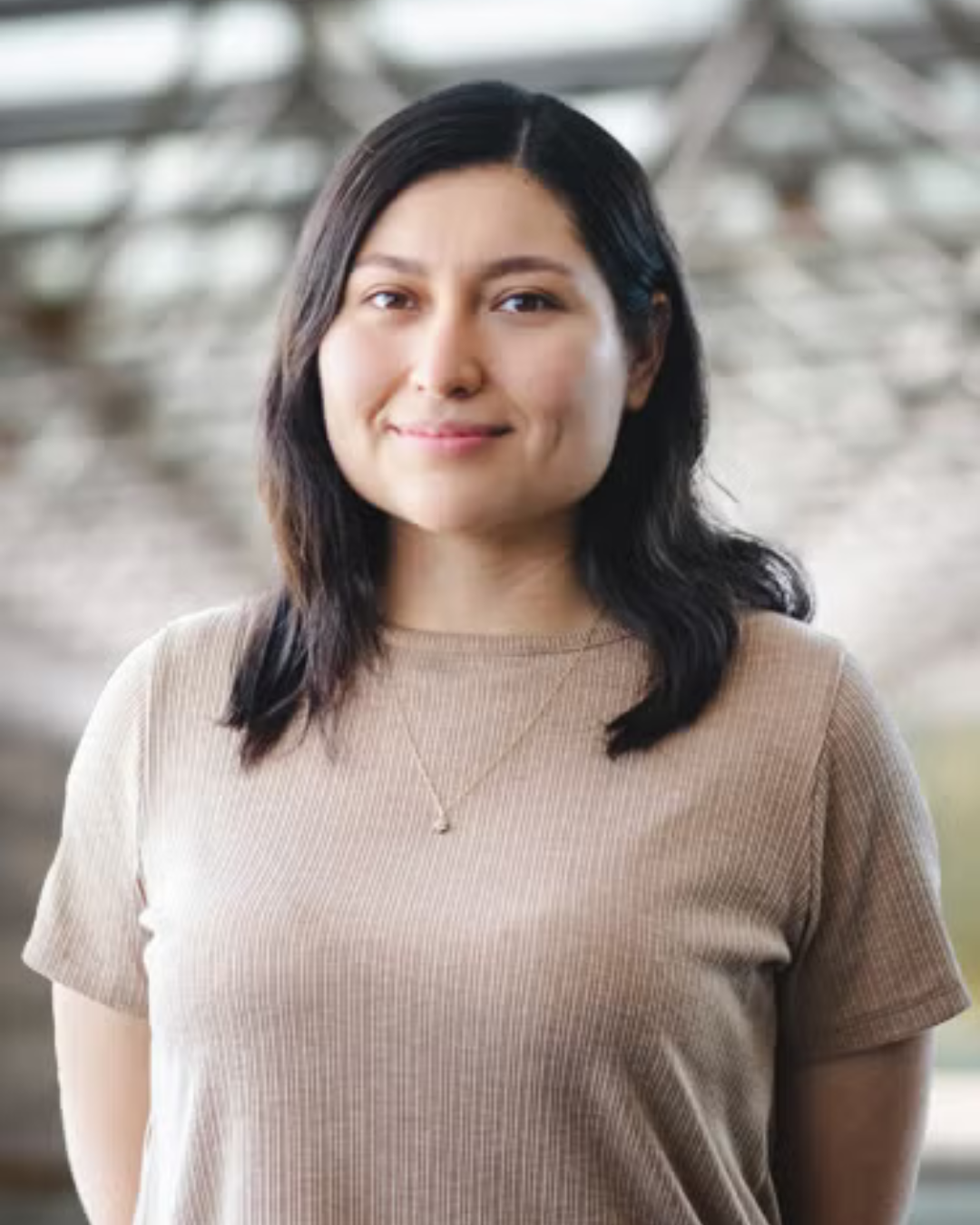 Maria Rosa Preciado Rivas wearing a heather grey T shirt