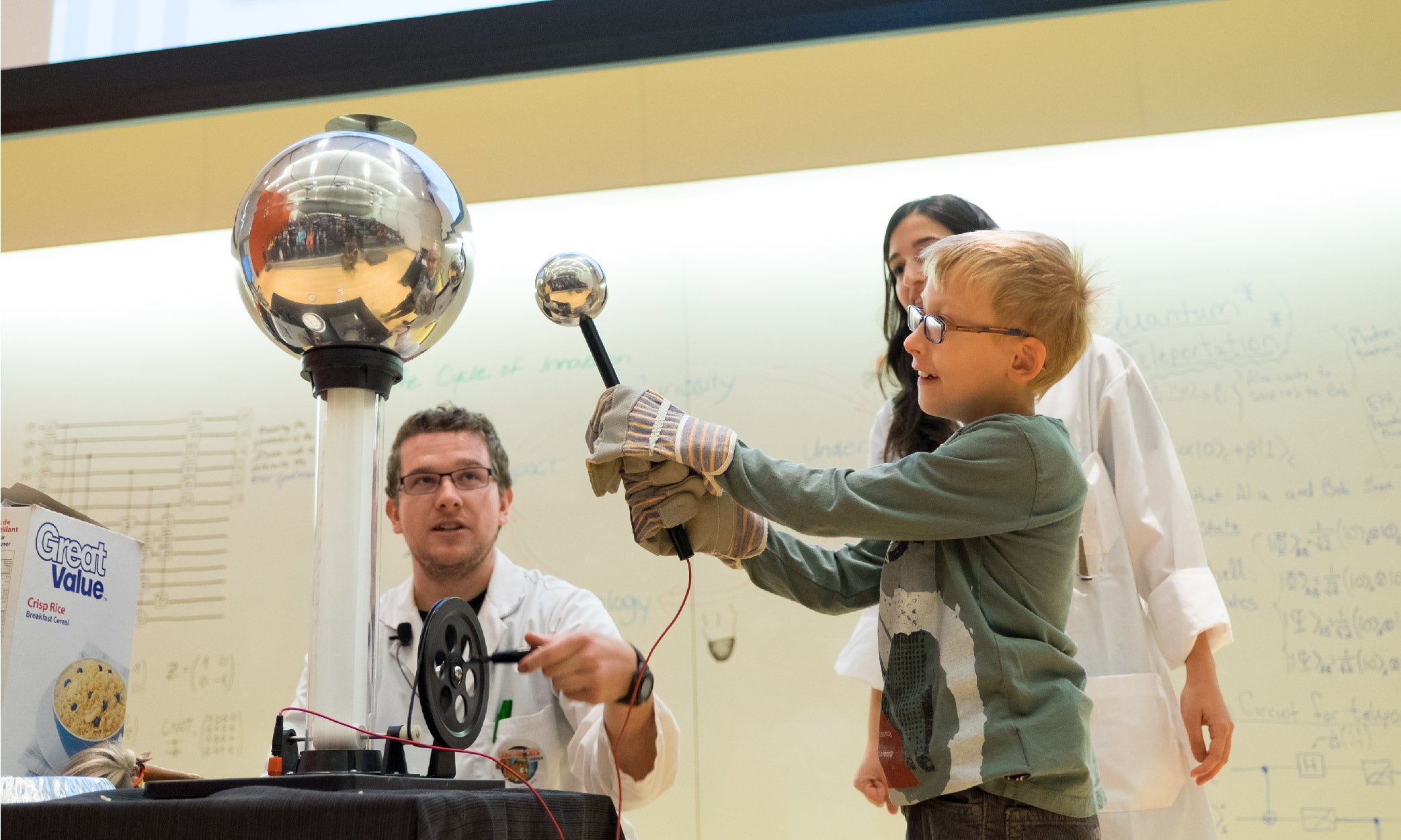 Young child takes part in a quantum science demonstration