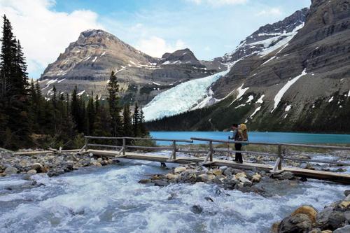 he photo was taken near the Berg Lake, the turquoise body of water that serves as the doorstep to the highest peak in the Canadian Rockies, Mt. Robson.  After an arduous 19 km hike, the thunderous noise from calved serac avalanches sends an unnerving feeling to the weary traveler.