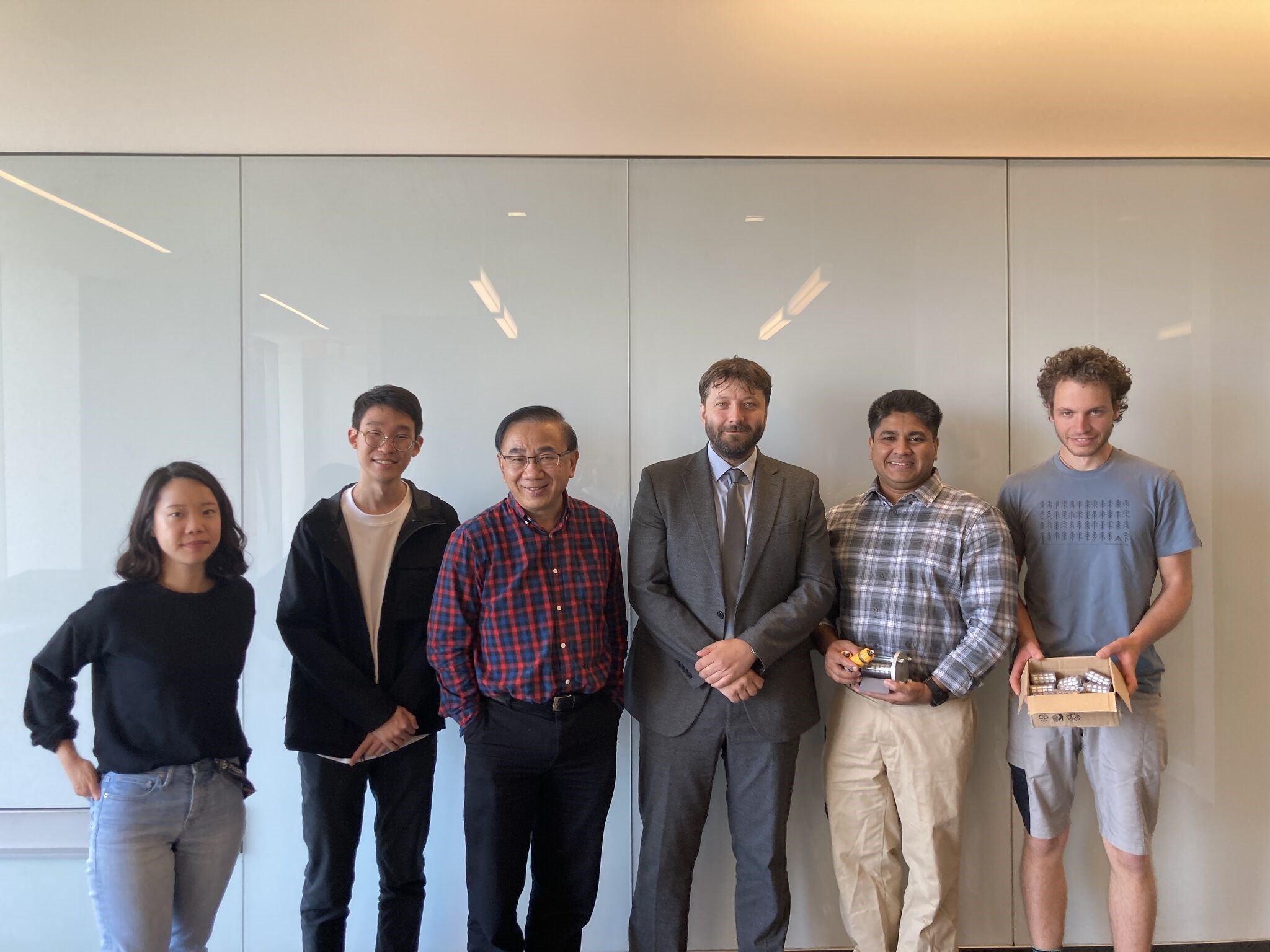 Jan Valtera and Michael Tam (center) with UWaterloo students