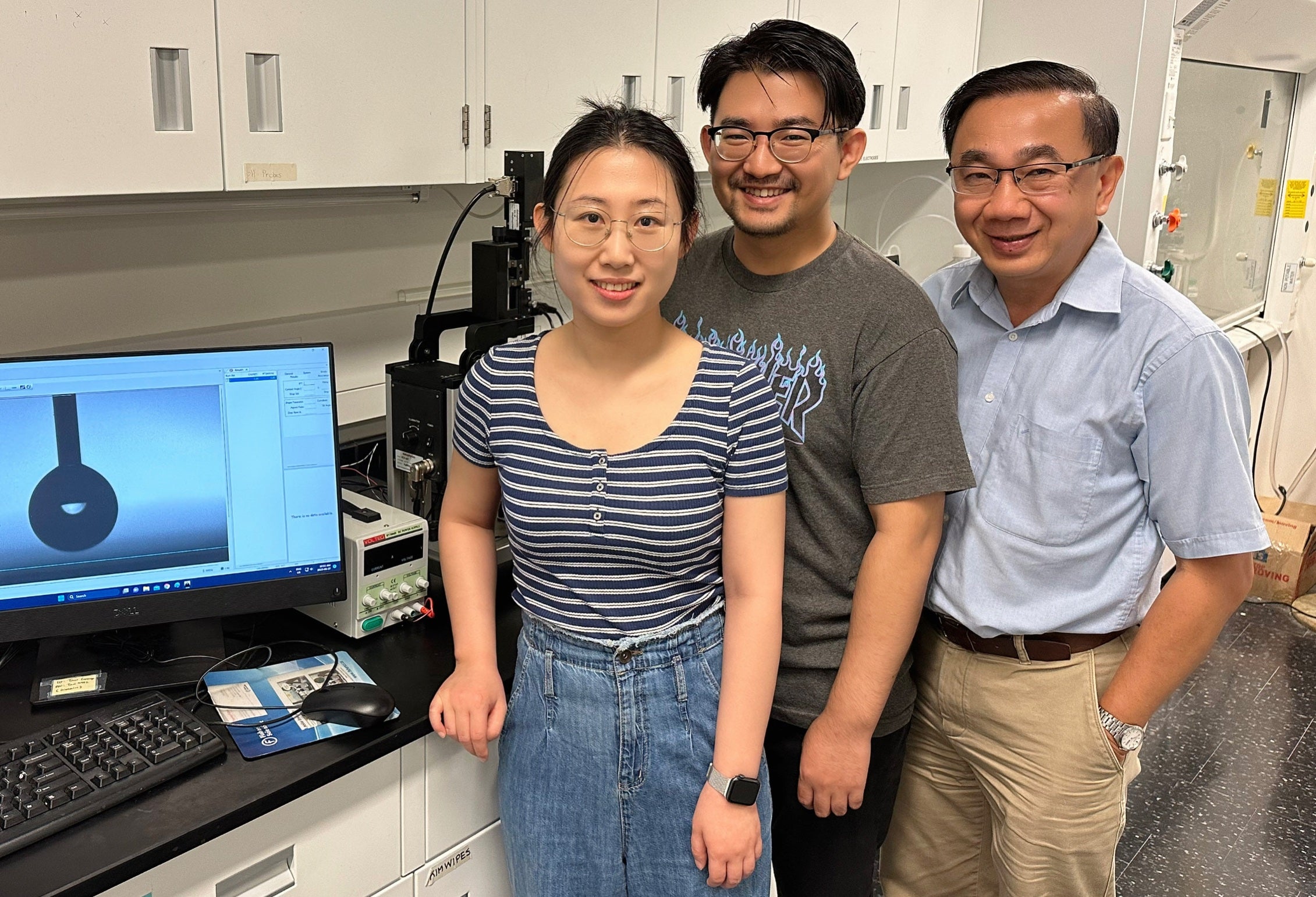 Professor Michael Tam and students in his lab.