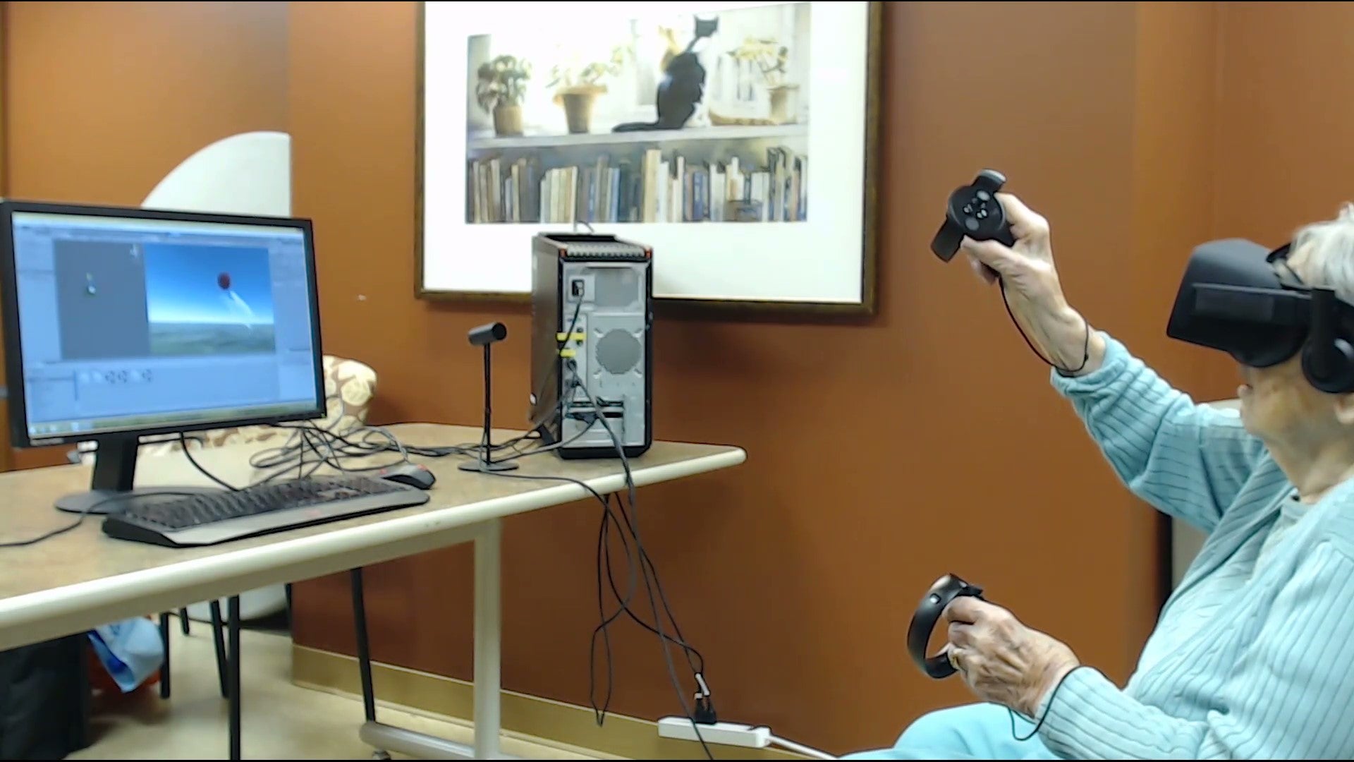 Older woman playing a virtual reality game