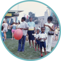 A vintage photo of a Black family attending an outdoor event in Waterloo Region
