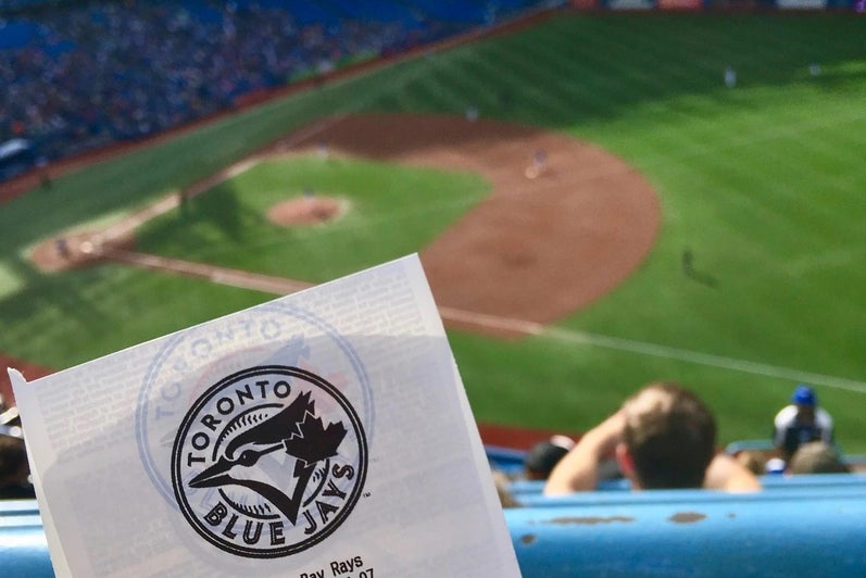 Blue Jay's game ticket in front of the diamond at Roger's Centre.