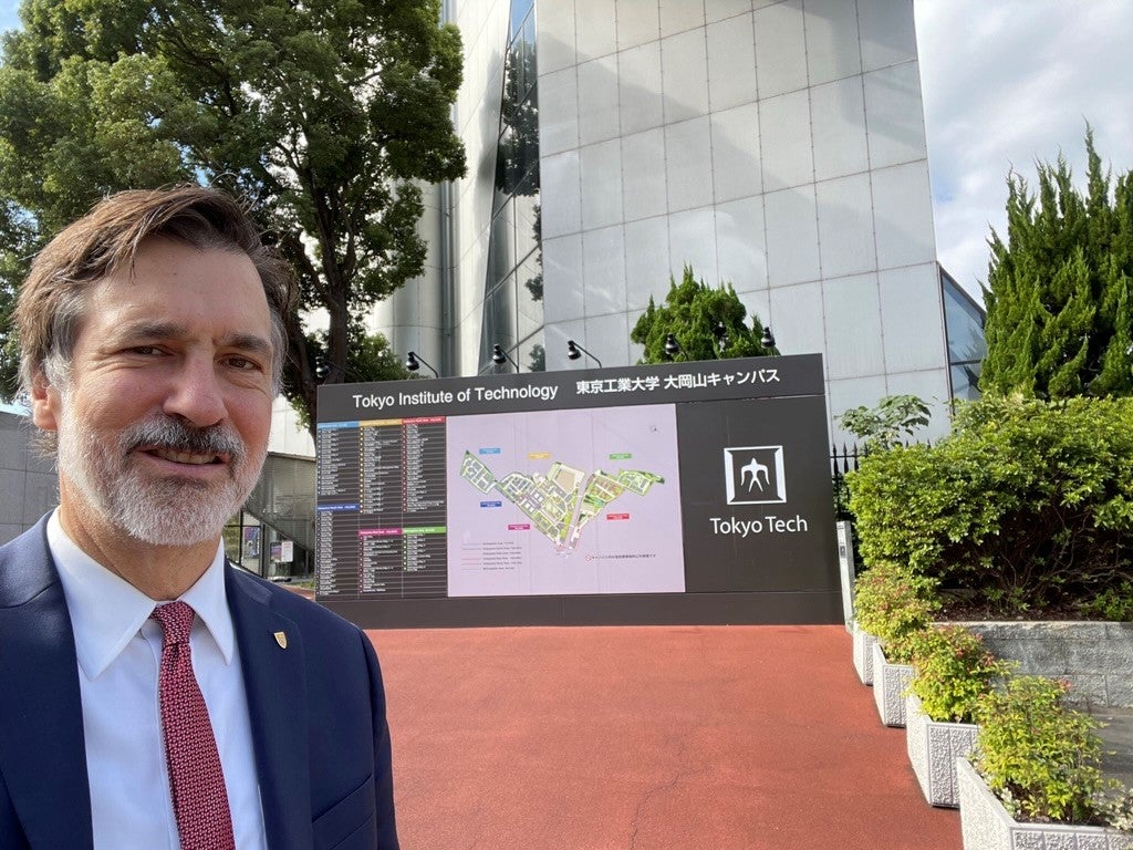 AVPI Ian Rowlands in front of Tokyo Tech sign