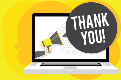 Laptop with speech bubble saying thank you