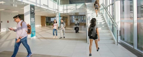 Students walking through Applied Health Sciences Expansion Building.