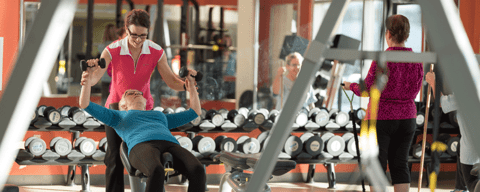 Older women using equipment at the gym.