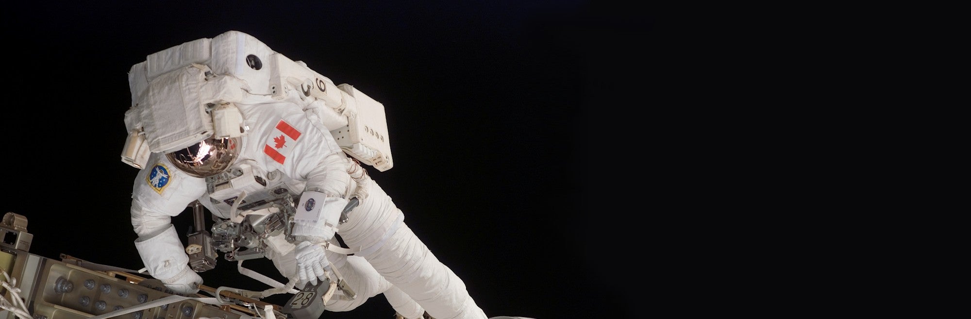 Canadian Space Agency astronaut on spacewalk.