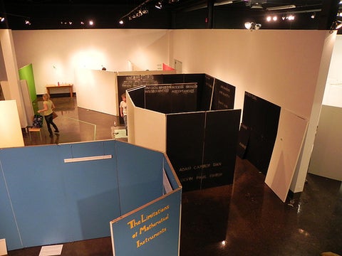 Overhead view of blue and black walls being constructed in the gallery.