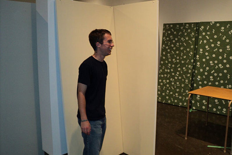 Student standing in gallery.
