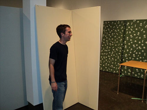 Student standing in gallery.