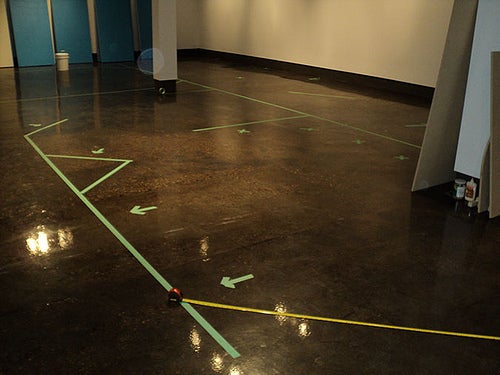 Tape lines outlining the floor plan.