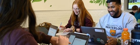 Three students on their laptops