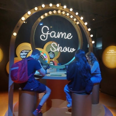 Three students on fake game show