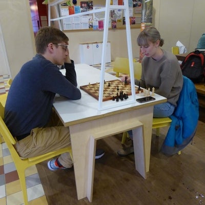 Students engage in a game of chess
