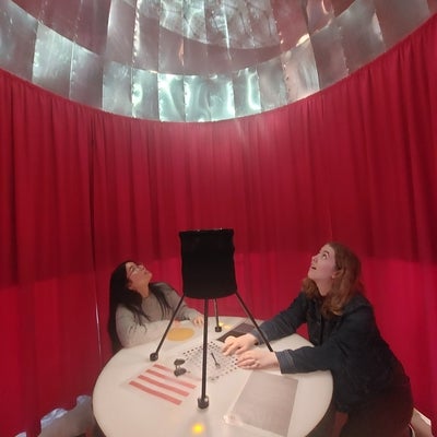 Two students working with a projector