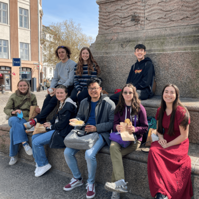 KI students sitting near a monument in Copenhagen