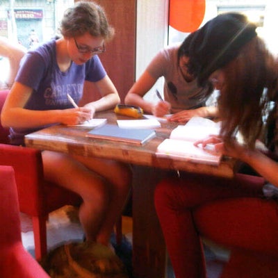 Students writing postcards