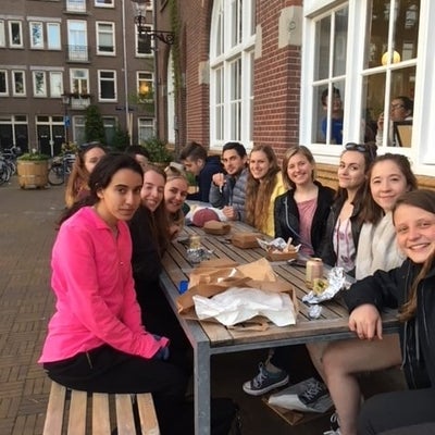 Students eating lunch outside the hostel