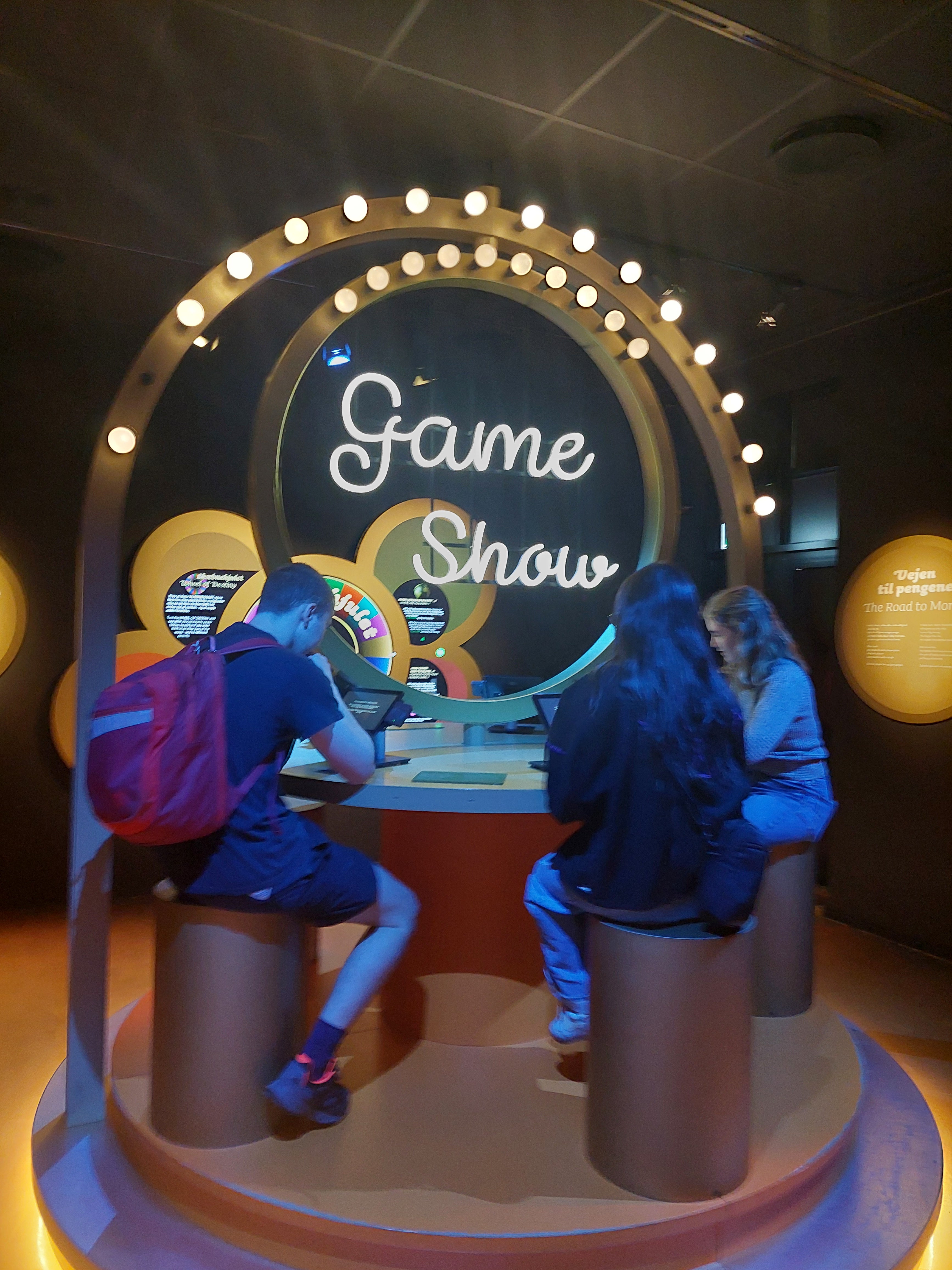 Three students on fake game show