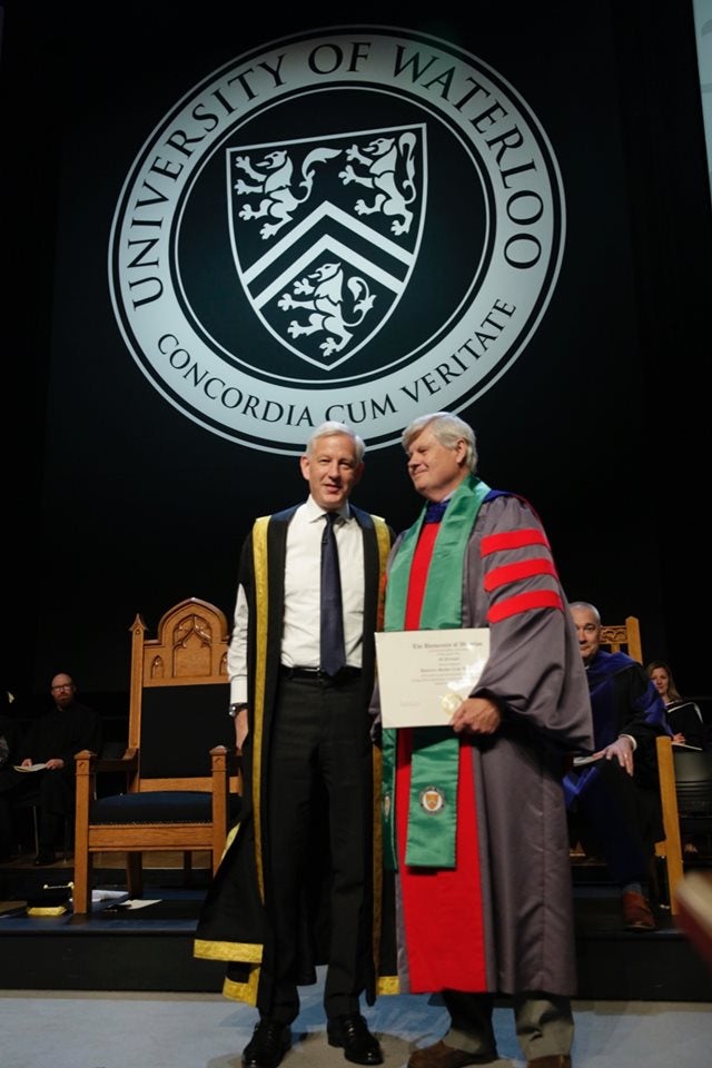 Ed Jernigan being present Honorary Member of the University by the Chancellor