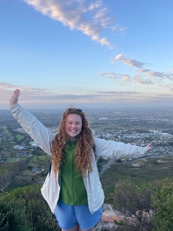 Sophia standing at a top of a hill