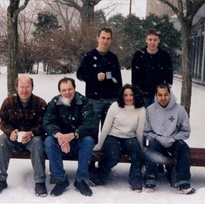 Jan Kycia research group posing outside in the spring time snow.