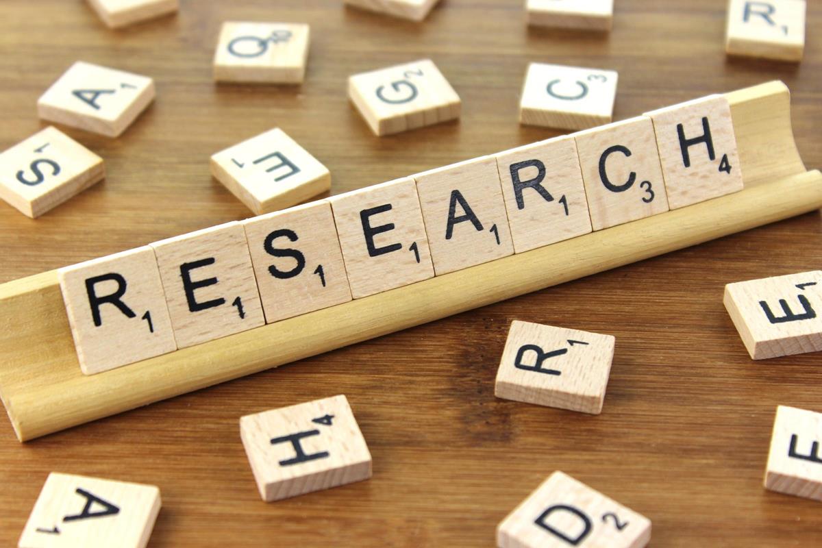 The word research in wood tiles