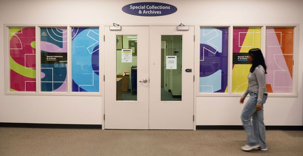 Entrance to SCA with student walking past.