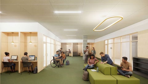 Bright, modern study space with cubicles on the left, green sectional seating on the right