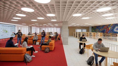 Group of students studying in a bright, modern library