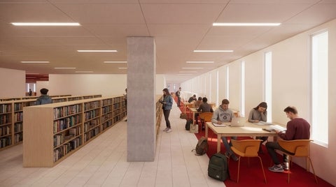 an interior setting with book shelves and study carrels