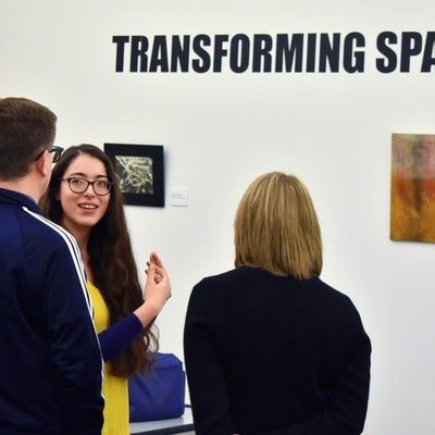 People looking at art