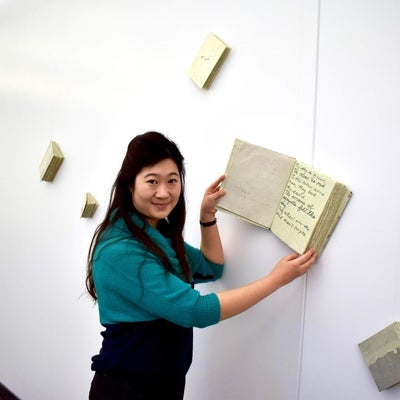 Artist with book installation