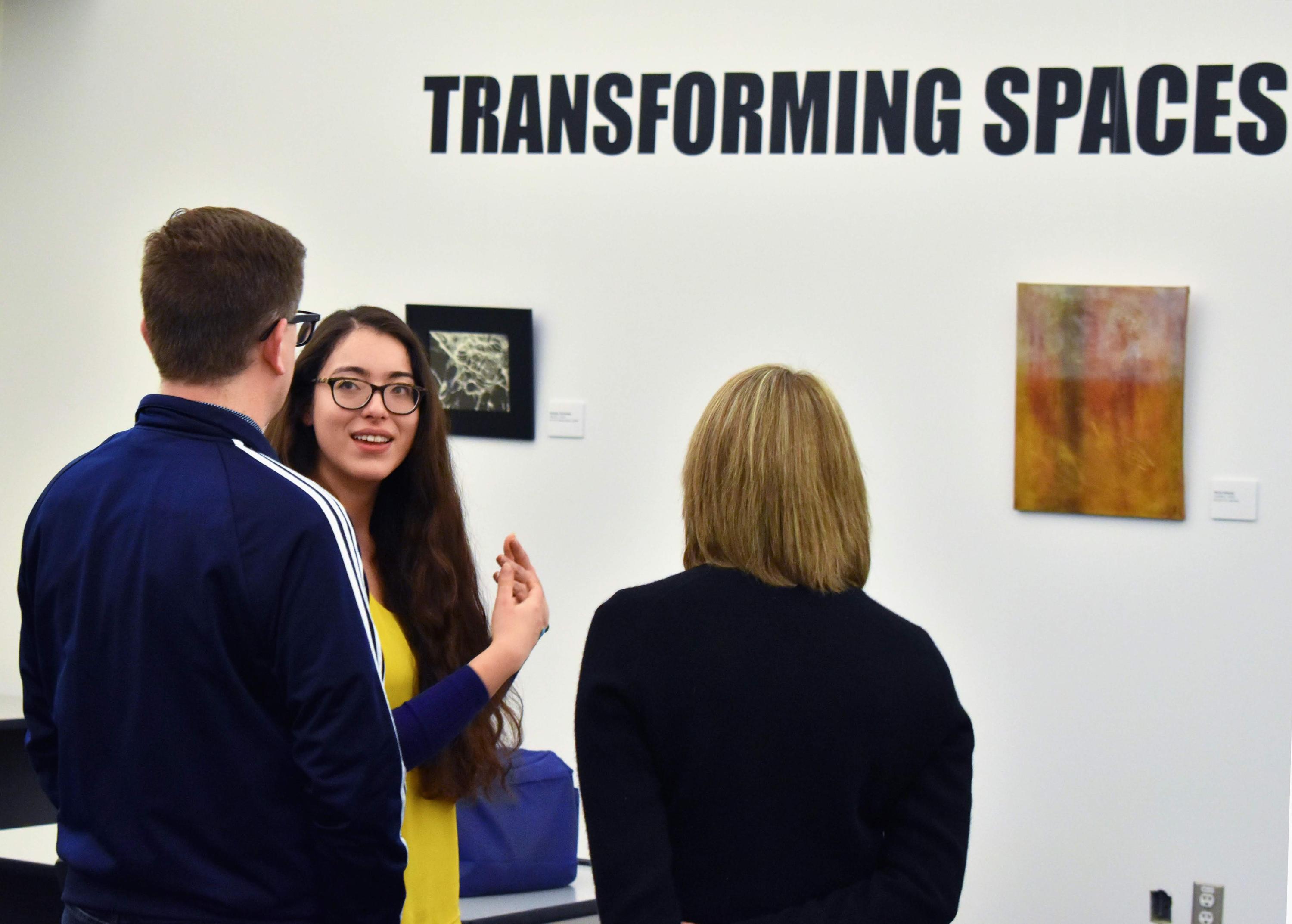 People looking at art